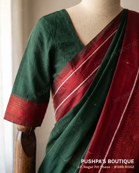 Ilkal saree with a red silk pallu with white stripes and a blouse with the red border on the sleeves