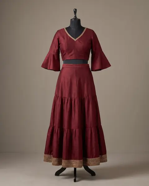 Example of a silk skirt: maroon silk tiered skirt with a zari border at the hem and a matching top