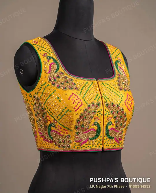 Yellow designer blouse with maggam peacock motifs, zardosi and cutdana beads