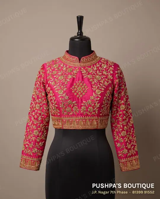 Rani-pink princess cut bridal blouse covered in zardosi, cutdana and zari, with full sleeves