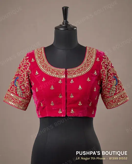 Rani-pink blouse with mirror and thread work on the neckline, body and sleeves