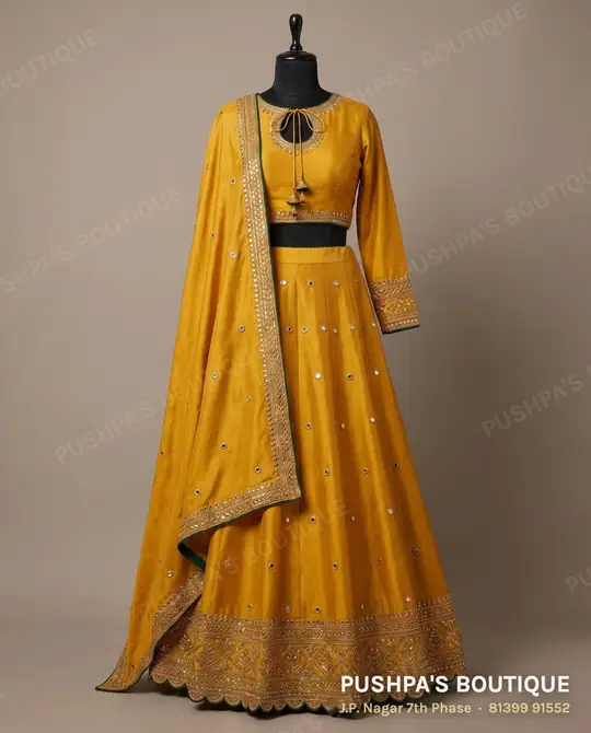 Mustard-yellow chaniya choli lehenga with a keyhole choli, sequin buttas and a wide border