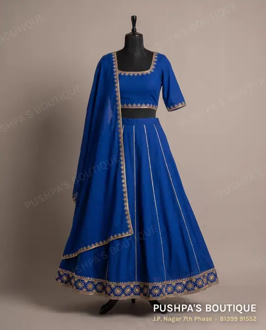 Royal-blue kalidar lehenga with kali panels, a bordered hem and a dupatta