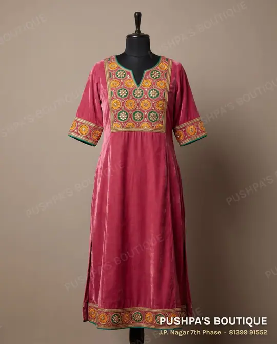 Onion-pink anarkali kurti with an embroidered yoke and bordered elbow sleeves